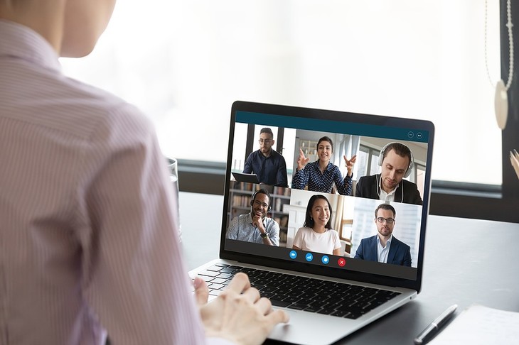 Video conference displayed on a laptop.